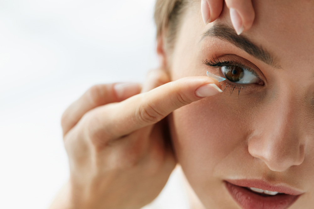 Women inserting a contact lense
